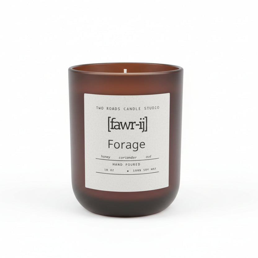 Candle with a label on a wooden surface