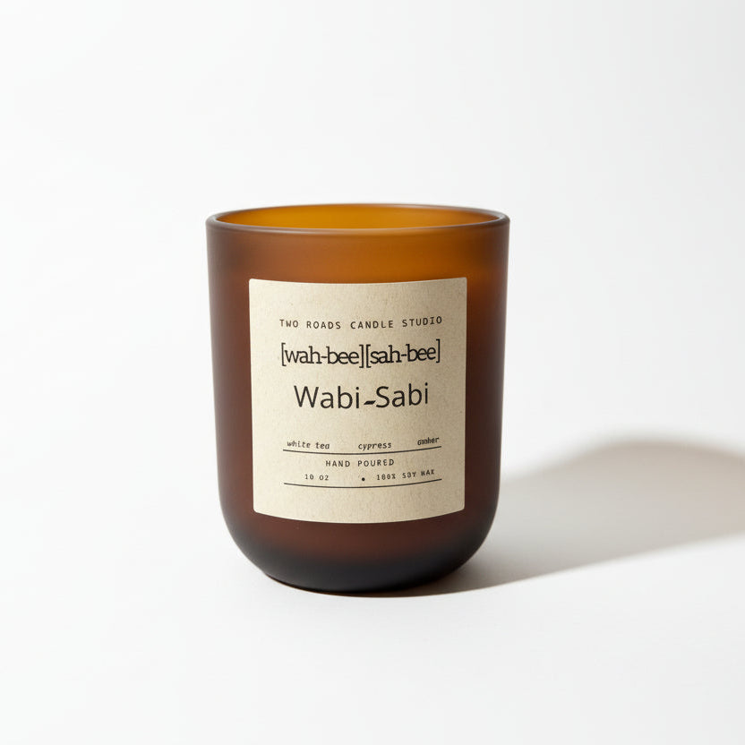 Brown candle with a label on a white background